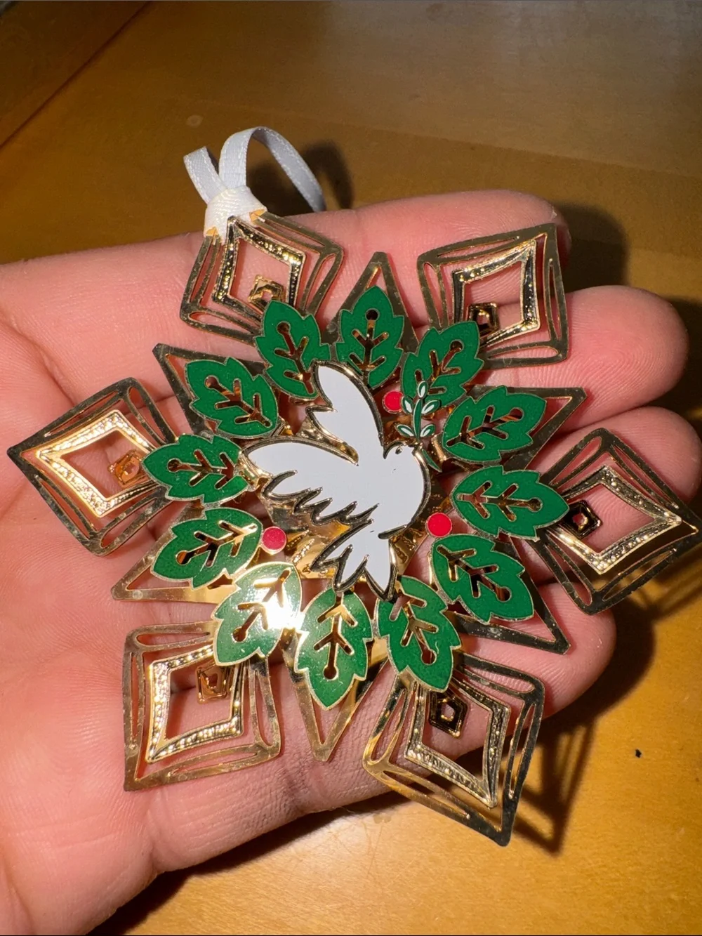 2 gold-finished decorative metal snowflake or floral ornaments made by ChemArt